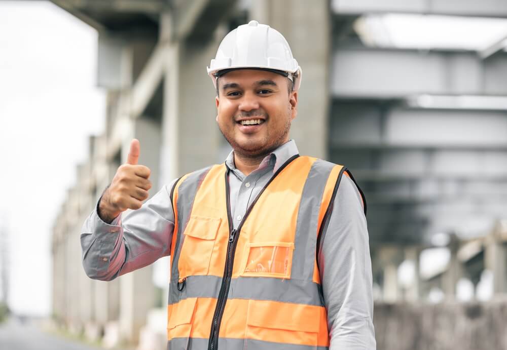 Engineer Handsome Man or Architect Looking Construction With White Safety Helmet in Construction Site