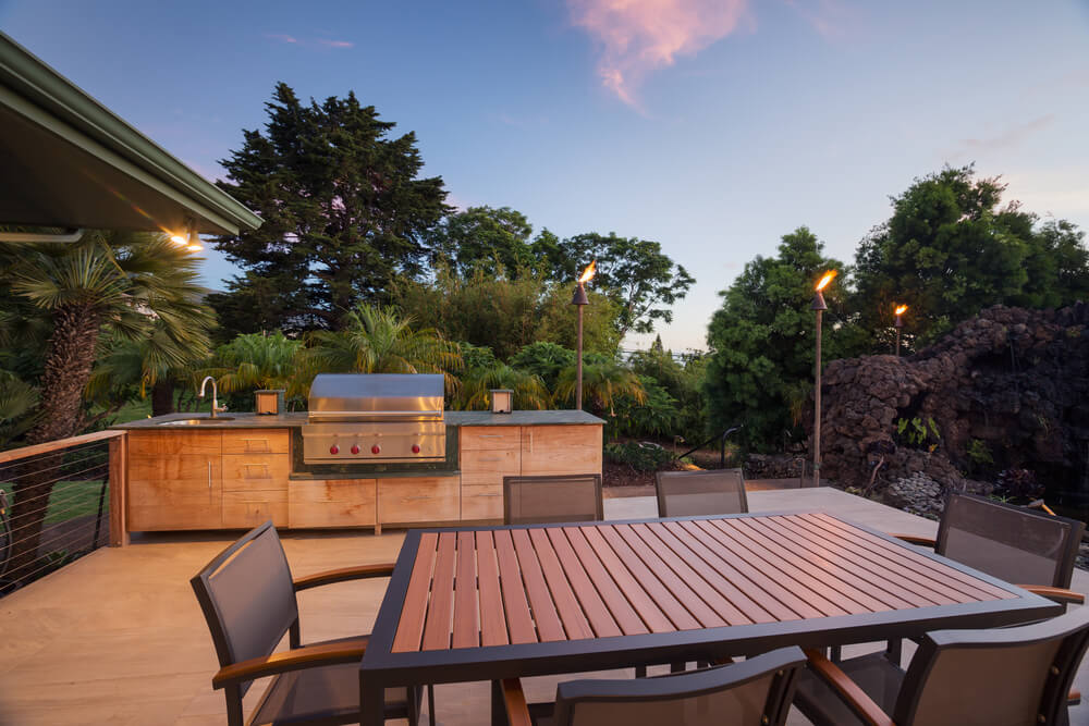 Backyard Patio With Bbq Grill and Dining Table on Deck