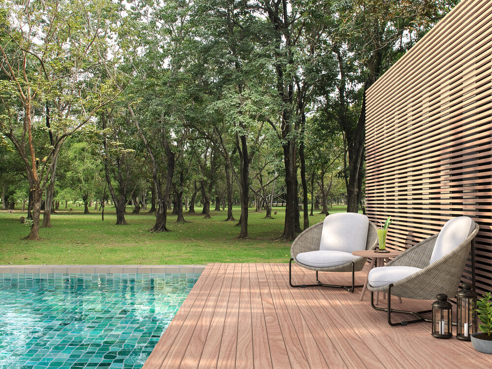 Swimming Pool Terrace With Garden View 3D Render, There Are a Wooden Floor ,Green Tile in the Swimming Pool and ,Wooden Lath Wall, Decorated With Rattan Furniture