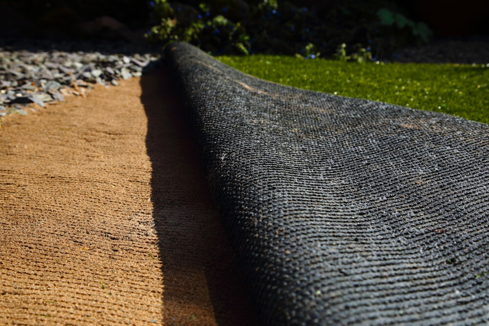 Laying Artificial Grass Turf Onto Sand in a Back Garden Yard