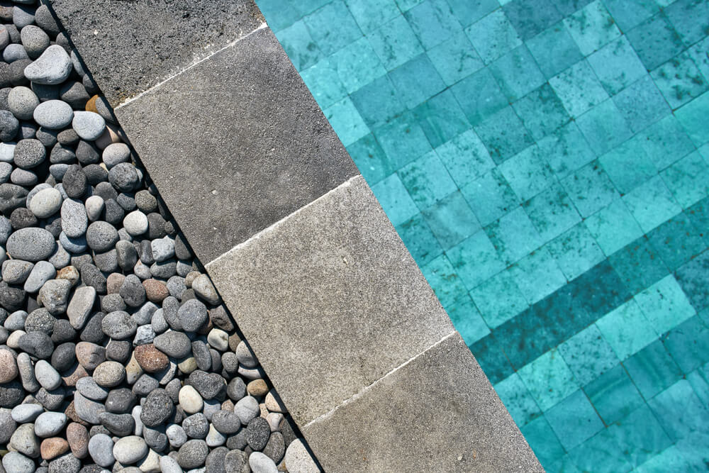 View From Above at a Swimming Pool With Blue Water Outdoors. 