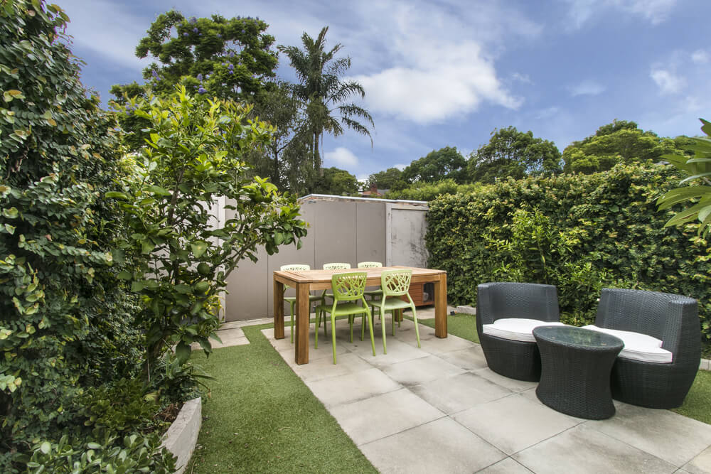 Back Yard With Outdoor Seating and Barbecue With Family