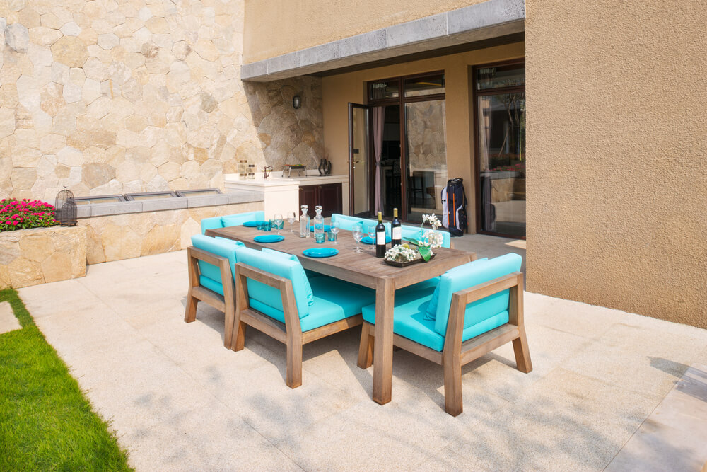 Elegant Furniture in the Patio in the Backyard With Marble Paving