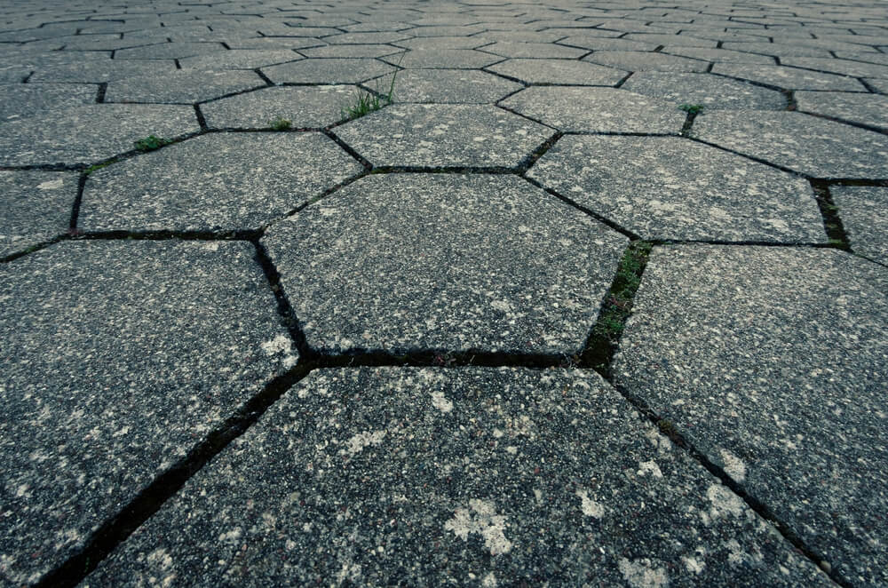 Hexagon pavement tiles made out of rough concrete