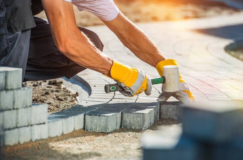 Garden Brick Pathway Paving by Professional Paver Worker
